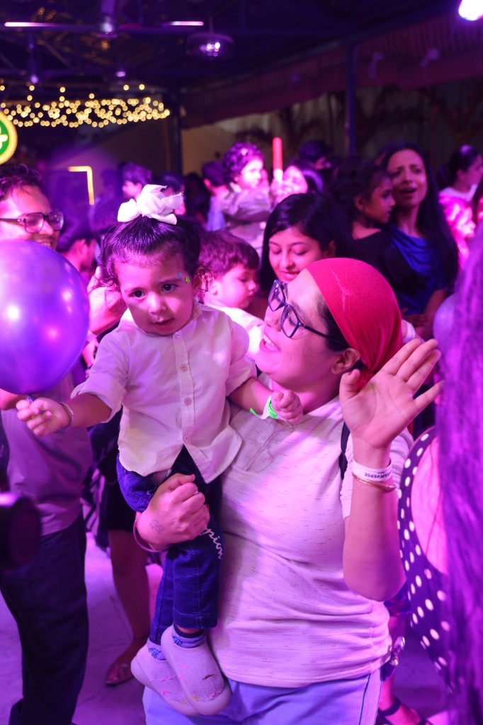 Toddler sitting on shoulders in the crowd