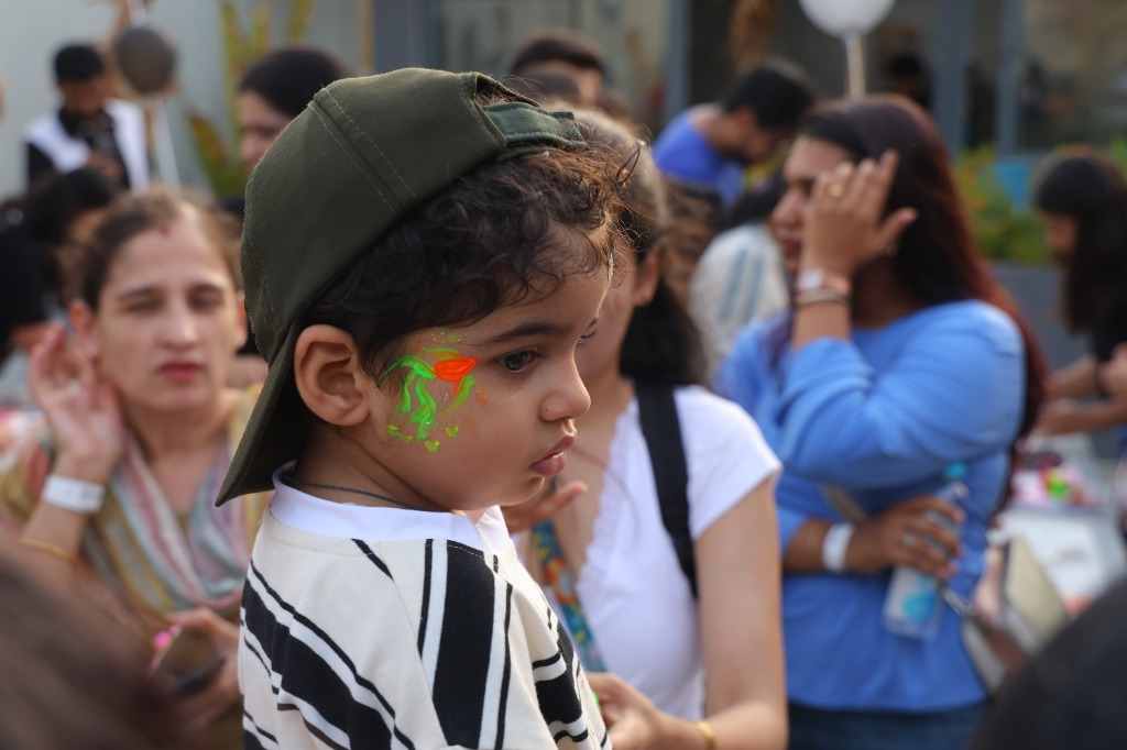 Toddler with neon face paint at Dreamverse Toddler Techno Party
